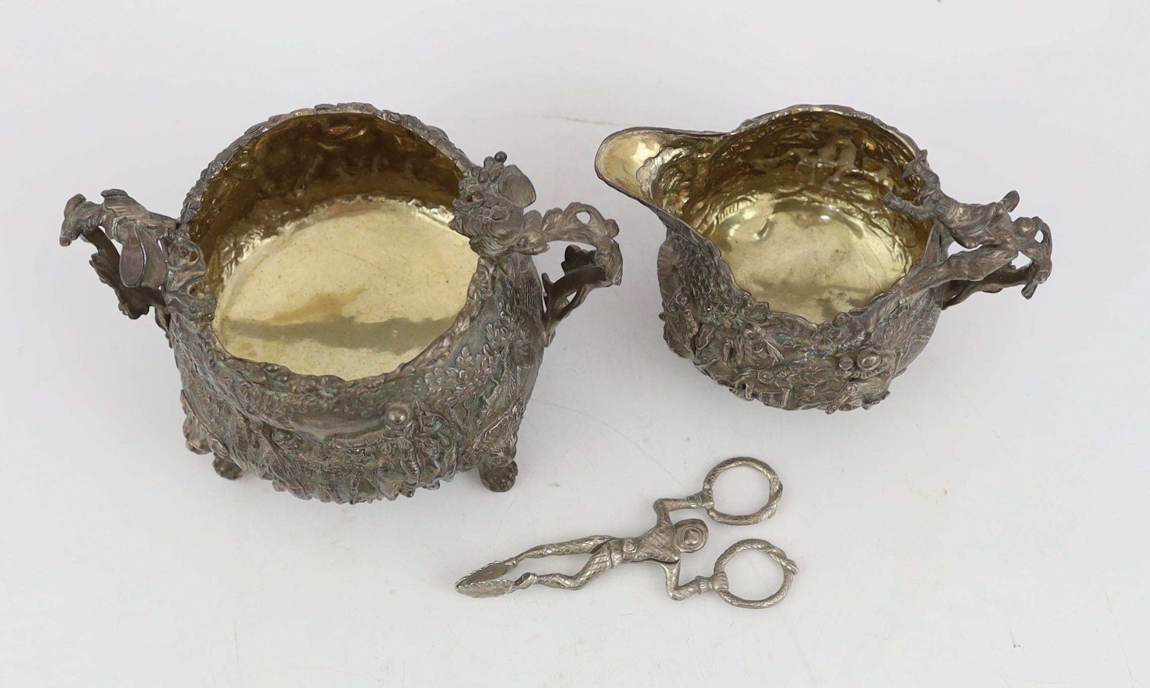 A George IV embossed silver sugar bowl and cream jug by Edward Farrell